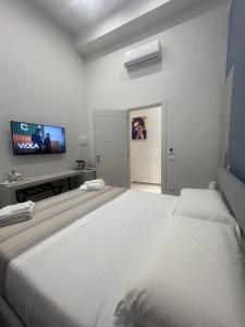 Cama o camas de una habitación en Dimora Chiaia 209