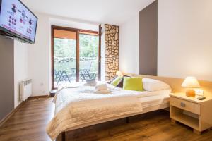 Posteľ alebo postele v izbe v ubytovaní Dolina Resort Zakopane + 37 fotografií
