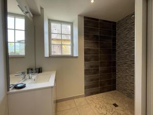 a bathroom with a sink and a shower at Chez zézé in Asson +43 photos