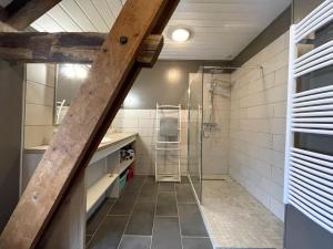 a bathroom with a shower and a walk in shower at Chez evon in Jurançon +23 photos