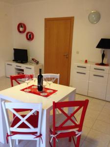 a kitchen with a table with wine glasses on it at Villa Jasmin in Bol