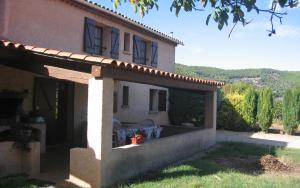 a large house with a patio in the yard at Gite calme et agreable in La Motte