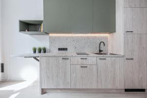 Kuchyň nebo kuchyňský kout v ubytování P-ONE APARTMENTS - Self Check-in