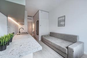Posezení v ubytování P-ONE APARTMENTS - Self Check-in