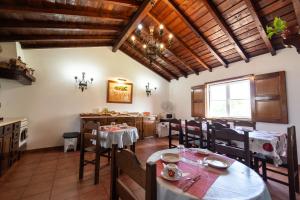 a kitchen and dining room with a table and chairs at Quinta do lagar in Chamusca