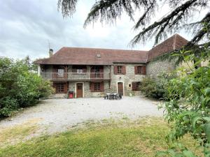 a large stone house with a large yard at Aguerre in Lichos