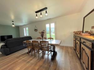 a kitchen and dining room with a table and chairs at Gure doya in Ibarrolle