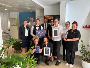 a group of people posing for a picture with their awards at Ibis Styles Menton Centre in Menton