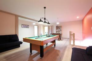 a living room with a pool table in it at Bordazarria in Juxue
