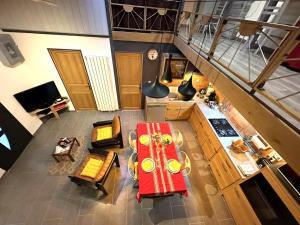 an overhead view of a living room with a red table at Bignasse in Saint-Vincent-de-Paul