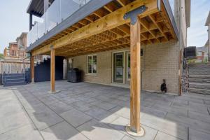 a patio with awning on top of a building at Modern and Cozy Basement Stay in Ajax in Ajax