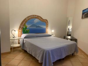a bedroom with a bed with an arch over it at Casa Marietta in Lipari