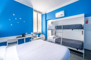 Postel nebo postele na pokoji v ubytování Hotel Fiume