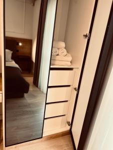 a mirror in a room with a closet at Apartments Mrdak in Bar