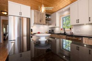 Foto sihtkohas Les Éboulements asuva majutusasutuse Chalet vue sur le fleuve et spa galeriist