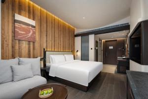 Voodi või voodid majutusasutuse Presidential Palace YiLi Hotel Nanjing toas