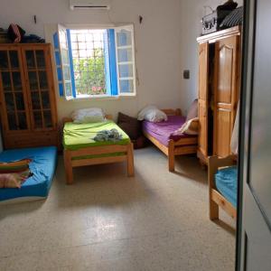 Ένα ή περισσότερα κρεβάτια σε δωμάτιο στο Pied dans l'eau sousse