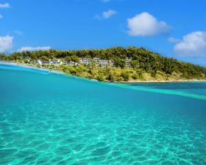 a view of an island in the ocean at Sani Club in Sani Beach