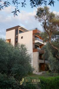 a building with a tree in front of it at OleaMar in Bar