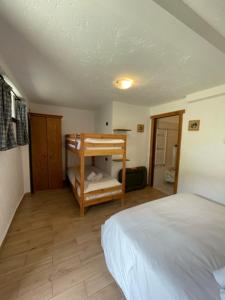 Letto o letti in una camera di Rifugio Baita Belvedere