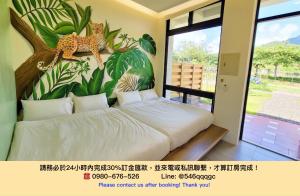 Postelja oz. postelje v sobi nastanitve 墾丁夏林灣民宿 包棟Villa-停車場-烤肉-近墾丁大街-大灣沙灘