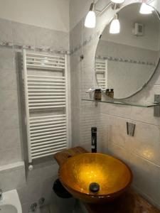 a bathroom with a wooden sink and a mirror at Rifugio Baita Belvedere in Champoluc