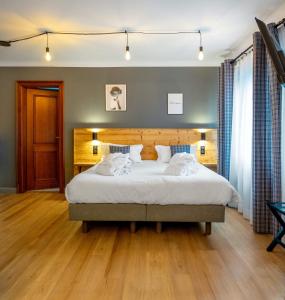 Postel nebo postele na pokoji v ubytování Hôtel au Heimbach