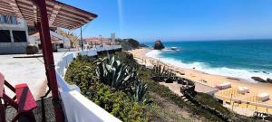 a view of the beach from the balcony of a resort at Close to the sea, to Lisbon and to your heart in Silveira