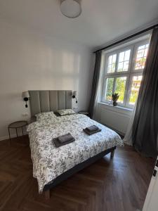 Posteľ alebo postele v izbe v ubytovaní Apartament Sonet Mickiewicza Sopot