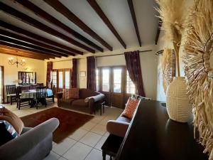 a living room with a couch and a table at Ndawana River Lodge in Underberg