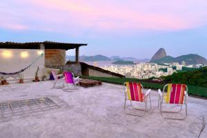 a group of chairs sitting on top of a building at La Bohème Casa Cultural - Santa Teresa in Rio de Janeiro