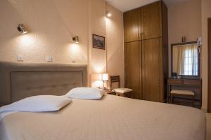 Krevet ili kreveti u jedinici u okviru objekta Olympic Hotel