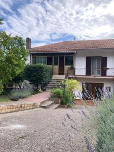 a white house with a porch and stairs to it at Casa Sisù-Appartamento immerso negli ulivi in SantʼElia Fiumerapido +30 photos