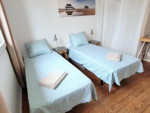 Ένα ή περισσότερα κρεβάτια σε δωμάτιο στο Villa avec jardin à Bordeaux