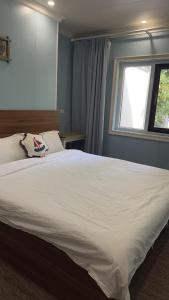 Voodi või voodid majutusasutuse Saipan Emerald Villa toas