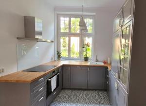 Kuchyňa alebo kuchynka v ubytovaní Apartament Sonet Mickiewicza Sopot