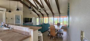a kitchen and living room with a couch and a table at Tequila Sunrise in Pensacola