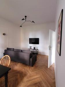 Televízia a/alebo spoločenská miestnosť v ubytovaní Apartament Sonet Mickiewicza Sopot