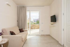Μια τηλεόραση ή/και κέντρο ψυχαγωγίας στο LE DIMORE DI Grè Suites con parcheggio privato
