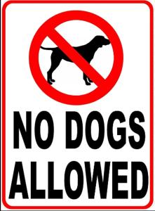 a no dogs allowed sign on a white sign with a dog in it at Ulvsvåg Gjestgiveri og Fjordcamping AS in Ulvsvåg