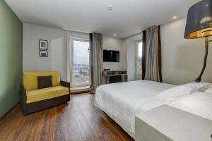 Postel nebo postele na pokoji v ubytování Hotel Tripoli