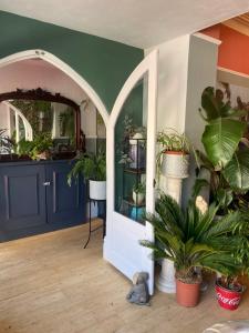a room with potted plants and an entry door at ParkRoyal Blackpool in Blackpool