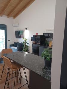 A kitchen or kitchenette at Apartamentos El Llanin