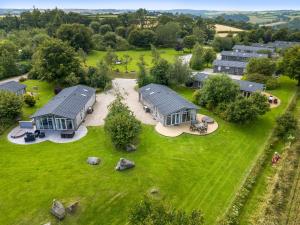an aerial view of a home with a yard at 23 Meadow Retreat in Liskeard