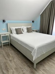 Postel nebo postele na pokoji v ubytování Halta Pescăruş Accommodation