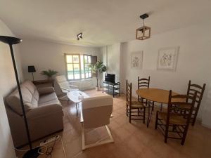 a living room with a couch and a table at Mies de Prado in Comillas
