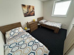Postel nebo postele na pokoji v ubytování Apartmány Miromar