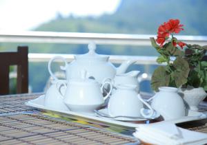 Příslušenství pro přípravu čaje a kávy v ubytování Sunrise view inn + 8 fotografií
