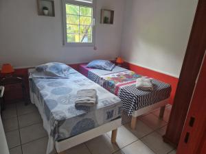 Postel nebo postele na pokoji v ubytování Bungalows Corail, F3 avec piscine à Sainte Luce + 9 fotografií