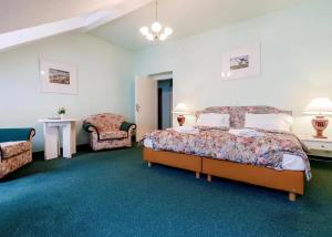 Postel nebo postele na pokoji v ubytování Hotel Ester